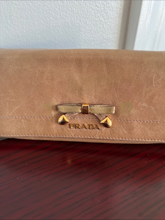 Prada Handbags - Prada Tan Leather Clutch with Gold Hardware